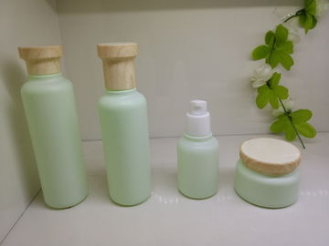 Botellas plásticas de empaquetado de la bomba del casquillo de la mirada de madera poner crema de las botellas del cosmético de cristal profesional