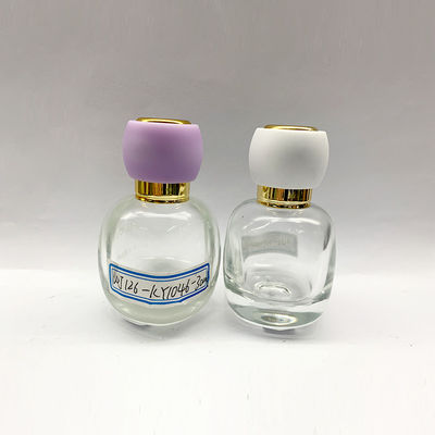 Botellas de perfume de lujo lindas redondas del diseño 30ml 50ml con el atomizador