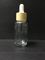 Botella transparente del dropper del cristal de botellas de aceite esencial 30ml con el empaquetado plástico de Skincare del casquillo