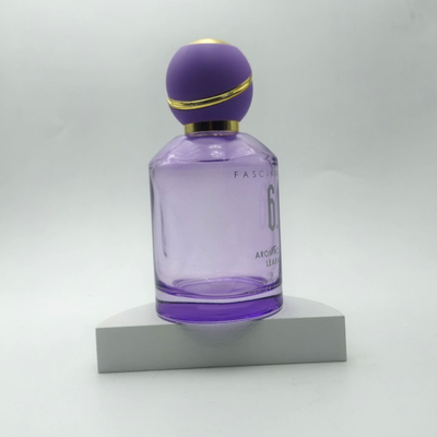 Botella de perfume redonda morada de 100 ml con tapón de bola redondo