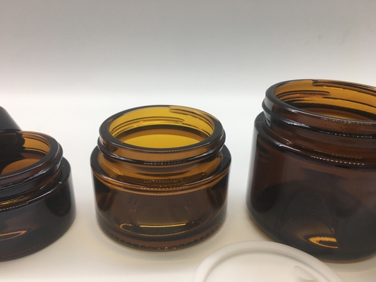 El repuesto cosmético transparente Amber Glass Jar Straight Round forma con la tapa negra plástica