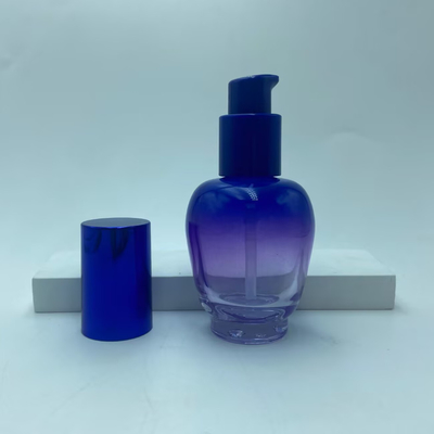 Botella de loción de vidrio 30ml Botella de suero de gradiente azul con bomba de aceite Botella de bomba Botella de cosmética OEM