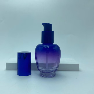 Botella de loción de vidrio 30ml Botella de suero de gradiente azul con bomba de aceite Botella de bomba Botella de cosmética OEM