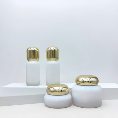 Envases cosméticos Botella de loción de vidrio Jar de crema Contenedores para el cuidado de la piel con tapa redonda de oro