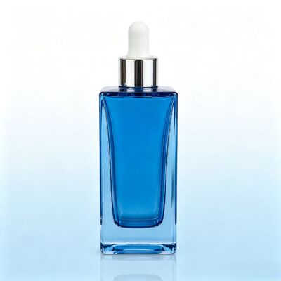 Botella gotero de vidrio transparente azul, botella de embalaje de aceite de suero cosmético de base gruesa y cuadrada con gotero de goma blanco