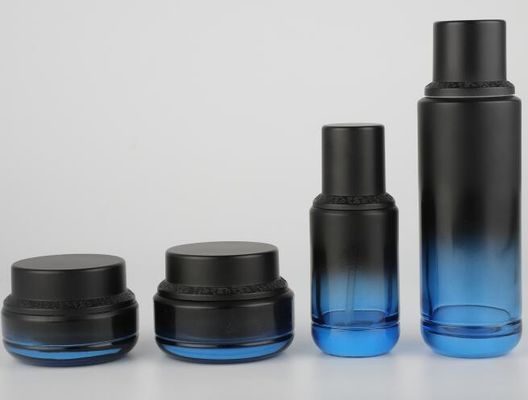 Envases de cristal de empaquetado del cuidado de piel del tarro de la crema de la botella de la loción del cosmético con el casquillo negro